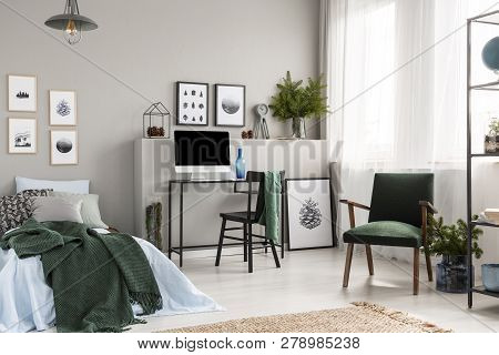 Elegant Grey Teenager Bedroom With Single Metal Bed With Blue Bedding And Grey Blanket, Real Photo W