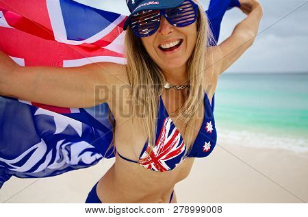 Cheerful Fun Loving Blonde-haired Woman Waving Proudly The Australian Flag. Aussie Supporter, Austra