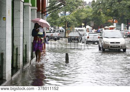 Salvador, Bahia / Brazil - September 23, 2014: Person Is Seen In A Flooded Street In The Calcada Nei