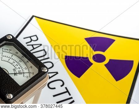 Hand-held Radiation Survey Instrument Detecting At The Radioactive Material Symbol On Label