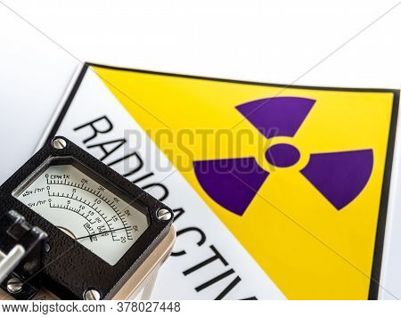 Hand-held Radiation Survey Instrument Detecting At The Radioactive Material Symbol On Label