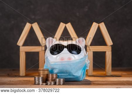Pandemic Real Estate Crisis. Masked Piggy Bank