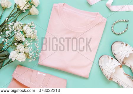 Mockup Of A Folded T-shirt Placed Surrounded By Trendy Aaccessories And Flowers Flat Lay