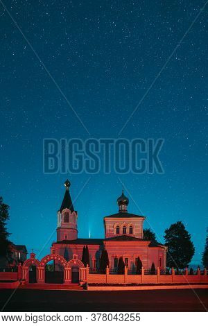 Korma Village, Dobrush District, Belarus. Comet Neowise C2020f3 In Night Starry Sky Above St. John T