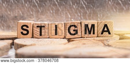 Wooden Blocks With The Word Stigma. Business And Finance Concept.