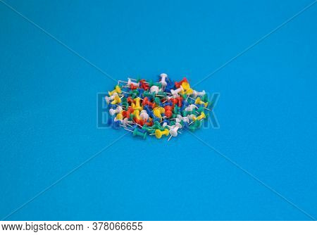 Multicolor Push Pins. A Great View Of Multicolored Push Pins Against A Blue Background