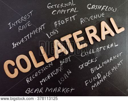 Collateral Text Displayed On Black Board With 3d Word On Dark Education Surface Texture.