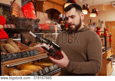 Young Man Shopping At The Bakery