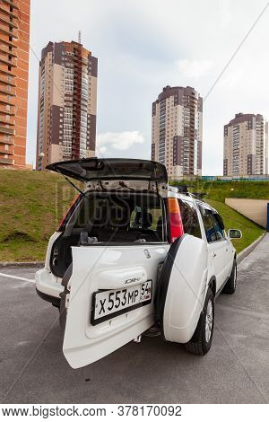 Novosibirsk, Russia - 07.06.2020: Honda Cr-v First Generation In White Color With Opened Trunk After