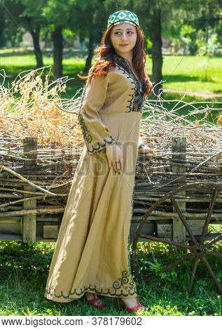 Armenian Young Woman In Traditional Clothes In The Forest