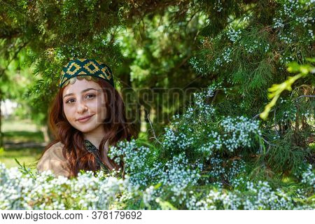 Armenian Young Woman In Traditional Clothes In The Forest