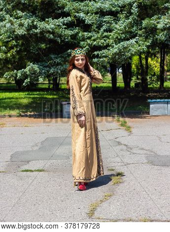 Armenian Young Woman In Traditional Clothes In The Forest