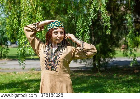 Armenian Young Woman In Traditional Clothes In The Forest