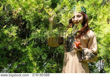 Armenian Young Woman In Traditional Clothes In The Forest