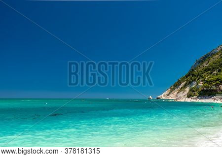 The Bay Of Portonovo With The Conero Mount In The Background In A Beautiful Summer Day