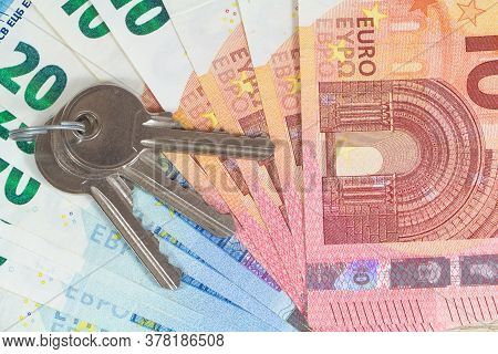 Keys And Banknotes Of Ten And Twenty Euros