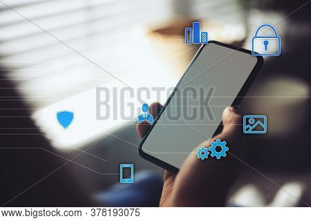 Information Security. Young Man Using Smartphone Indoors, Closeup