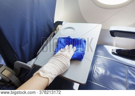 Close Up Hand Is Wearing Gloves Cleaning Aircraft For Covid-19 Prevention Pandemic