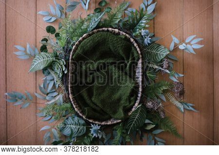 Newborn Digital Background - Natural Woven Bowl With Green Knitted Filler Layer And Tropical Garland