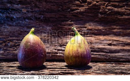 Fresh Fig Fruits On Aged Wooden Background