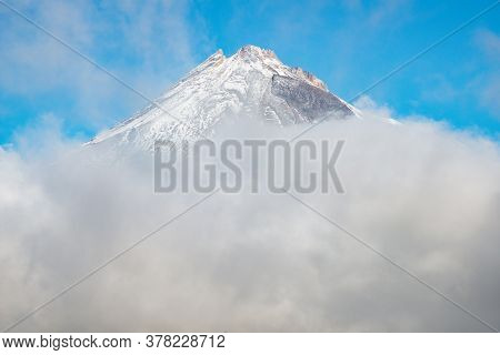 The Scenery View Of Mt.taranaki (mount Egmont) Behind The Clouds. This Mountain Is One Of The Popula