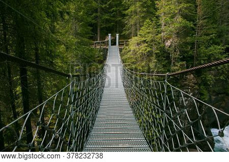 View Of Suspended Tibetan Bridge In The Natural Park Of Paneveggio Pale Di San Martino, Val Di Fiemm