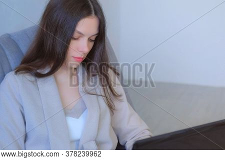 Freelancer Woman Working Typing On Laptop At Home Sitting On Couch, Freelance Distant Work On Quaran