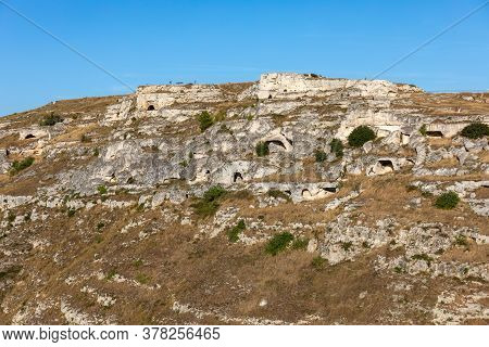View Of Gravina River Canyon And Park Of The Rupestrian Churches Of Matera With Houses In Caves Di M
