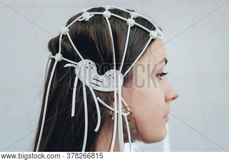 Doctor And Patient With Encephalography Electrode. Electroencephalogram
