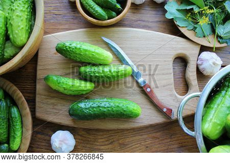Cucumber Canning Concept. Fermented Pickled Cucumbers, Dill , Garlic On Wooden Table