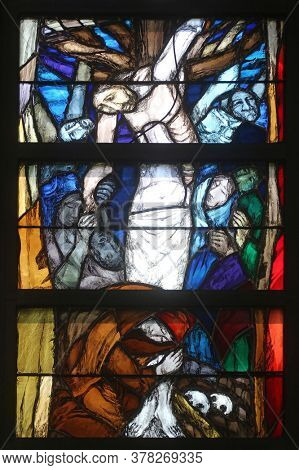 PIFLAS, GERMANY - JUNE 07, 2015: Godâs promise gives men courage and hope in the path of their lives and salvation, detail of stained glass window by Sieger Koder in St. John church in Piflas, Germany