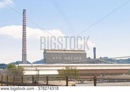 La Spezia, Italy - July 27, 2020 - A Shed And The Chimney Of Oto Melara, An Italian Manufacturer Of 