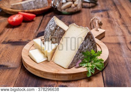 Pieces Of Cheese Tomme De Montagne Or Tomme De Savoie Made From Cow Milk In French Alps.