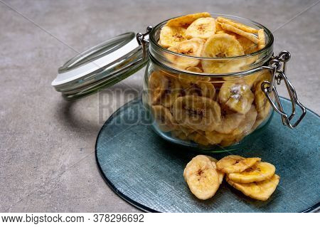 Healthy Sweet Snack, Crispy Dehydrated Unsugared Banana Chips In Glass Jar