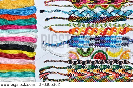 Woven Handmade Friendship Bracelets With Bright Colorful Pattern  With Thread On White Background