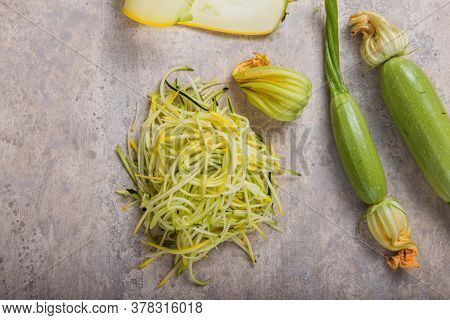 Zucchini Vegetable Noodles - Green Zoodles Or Courgette Spaghetti On Plate Over Gray Background. Cle