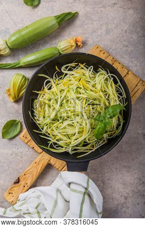 Zucchini Vegetable Noodles - Green Zoodles Or Courgette Spaghetti On Plate Over Gray Background. Cle