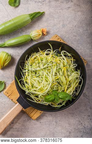 Zucchini Vegetable Noodles - Green Zoodles Or Courgette Spaghetti On Plate Over Gray Background. Cle