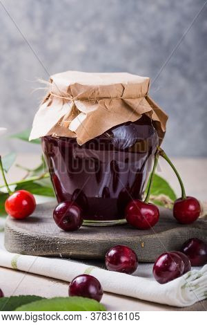 Homemade Sweet And Sour Cherry Jam With Fresh Cherries On Light Table, Copy Space. Sweet And Sour Ch