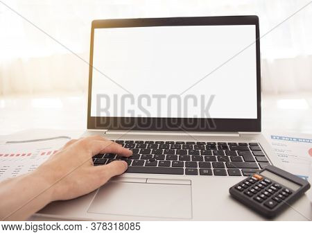 Man's Hands Typing On Laptop Keyboard With White Background