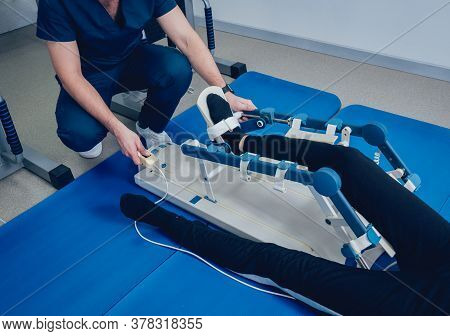 Patient On Cpm Machines. Continuous Passive Range Of Motion.