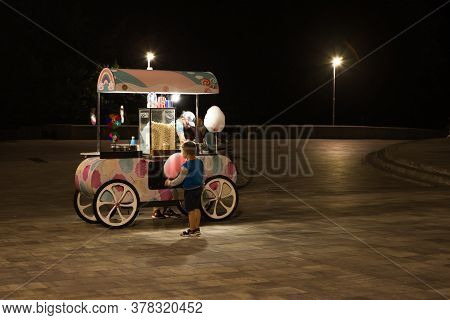 Kiev, Ukraine: 16 July, 2020 - Street Cotton Candy Cart Or Shop With Swetness And With Seller. Young