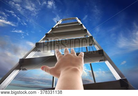 Woman Climbing Up Stepladder Against Blue Sky With Clouds, Closeup