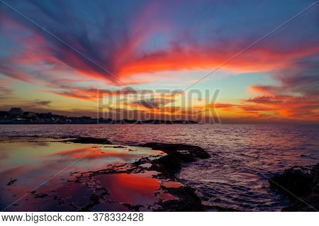 Beautiful Landscape of an Amazing Sunset Sky over Beach. Coastal Fishing Village. Traveling to Northern Lebanon. Anfeh.