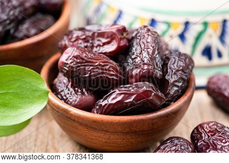 Dried Dates In Bowl. Tasty Medjool Dates. Arabic Islamic Food