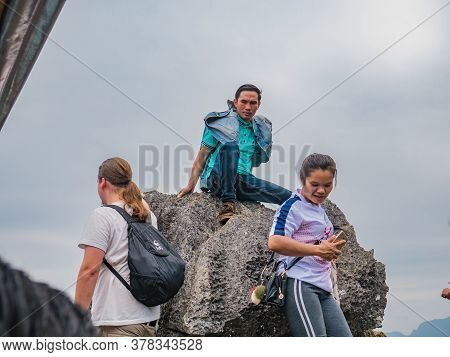Vangvieng/lao-10 Dec 2017:unacquainted Tourist On Mountain Peak Of Pha Ngeun In Vangvieng City Laos.