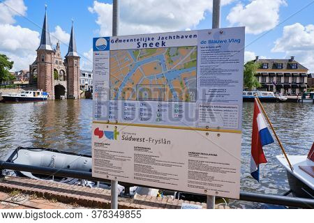 Sneek, Netherlands, July 20, 2020:sneek Harbor Sign Regulations In Dutch, English, German. With Boat