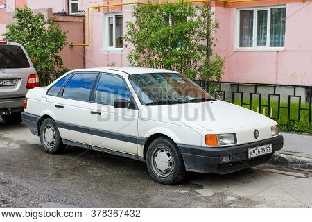 Novyy Urengoy, Russia - June 16, 2020: White Saloon Car Volkswagen Passat In The City Street.