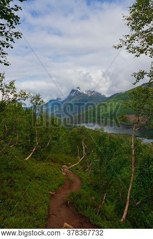 Norwegian Mountain Trail Looking Out To A Nice Lake In The Mountainrange