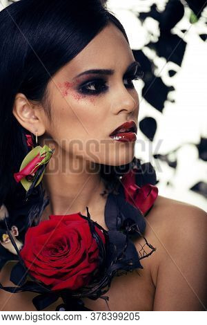 Pretty Brunette Woman With Rose Jewelry, Black And Red, Bright Make Up Kike A Vampire Closeup Red Li